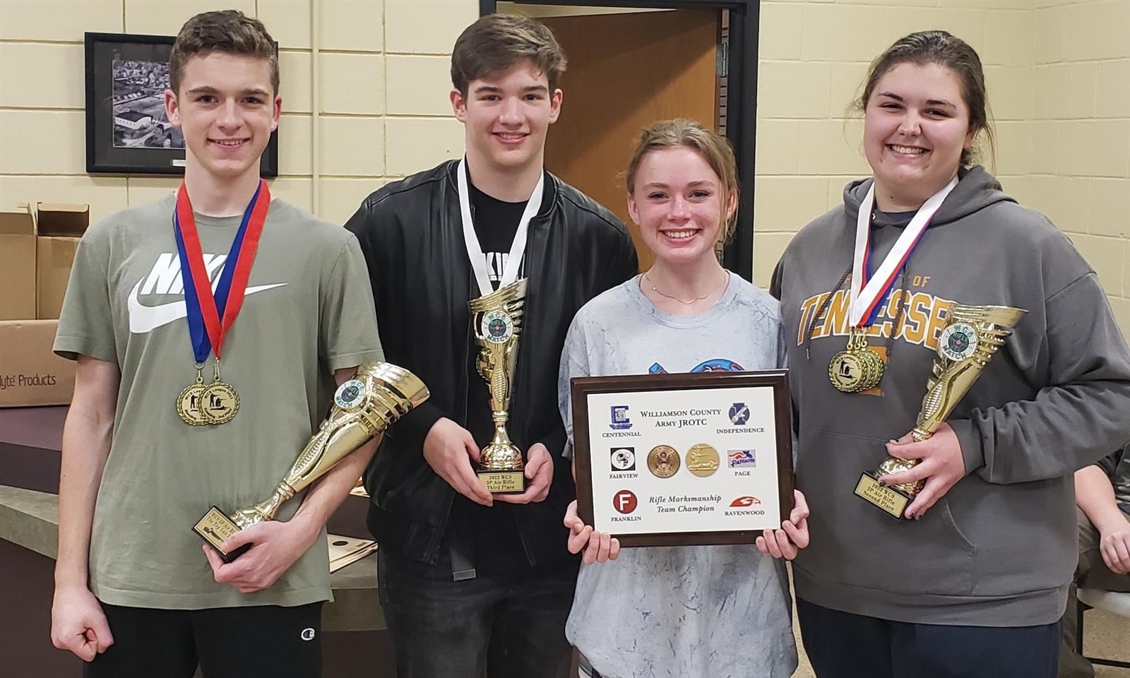 Page High JROTC cadets hold trophies